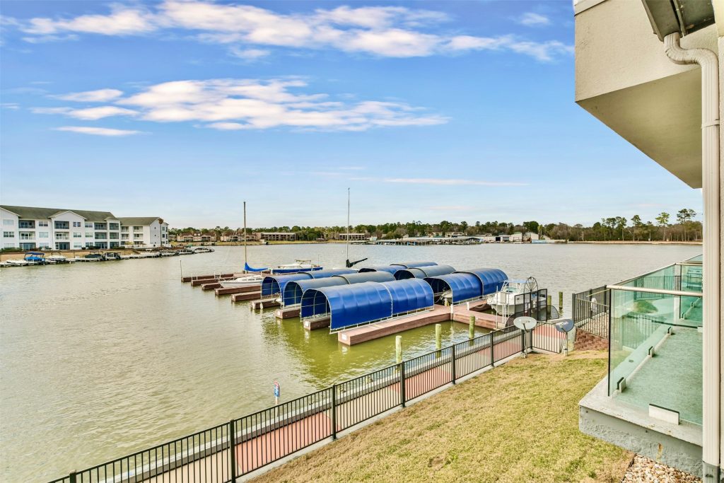 Wide shot of boat slips by Lake Conroe condos.