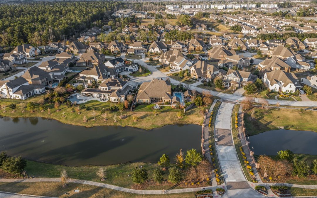 Aerial view of a high end neighborhood of Lake Conroe homes by the water.